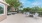 a patio with benches and trees