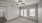 Living room with wide open space, built in book shelf, and ceiling fan