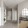 a living room with a couch and table and mirror