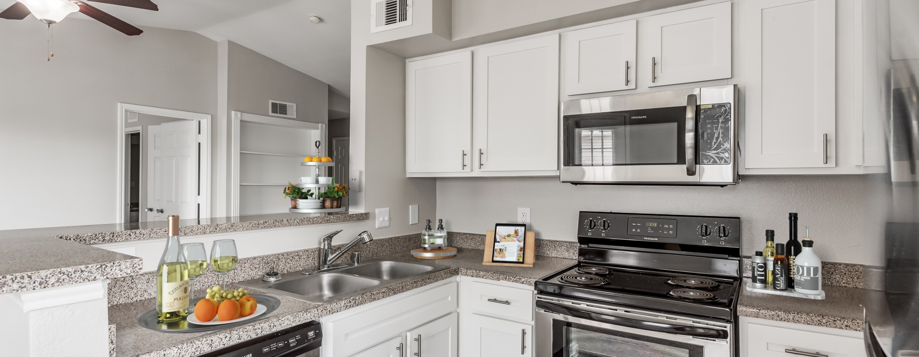 a kitchen with white cabinets