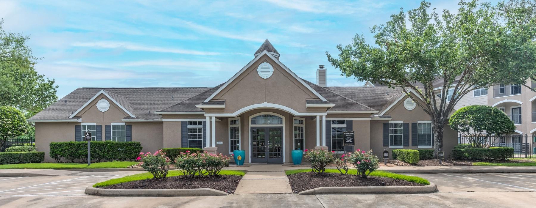 clubhouse with parking lot