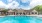 a clubhouse with a pool